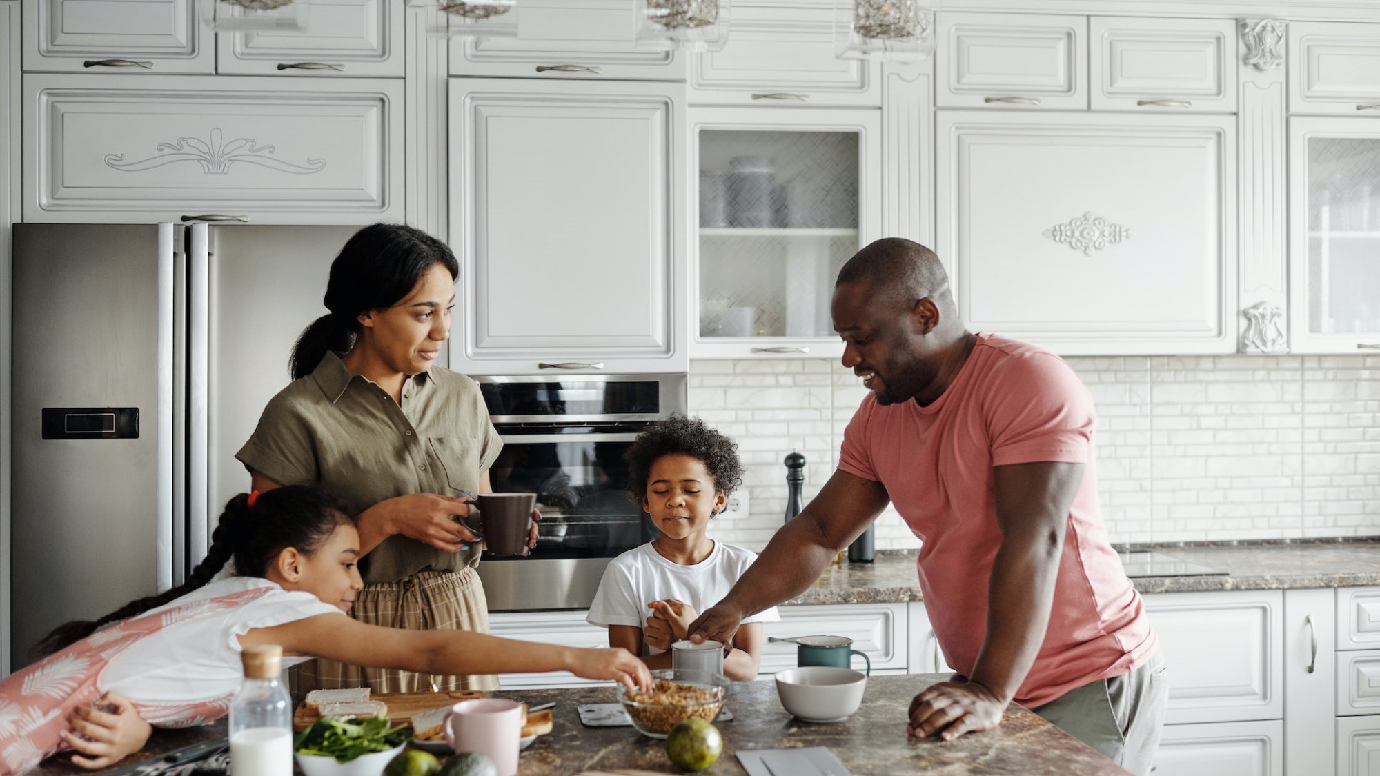 Family in kitchen for home insurance